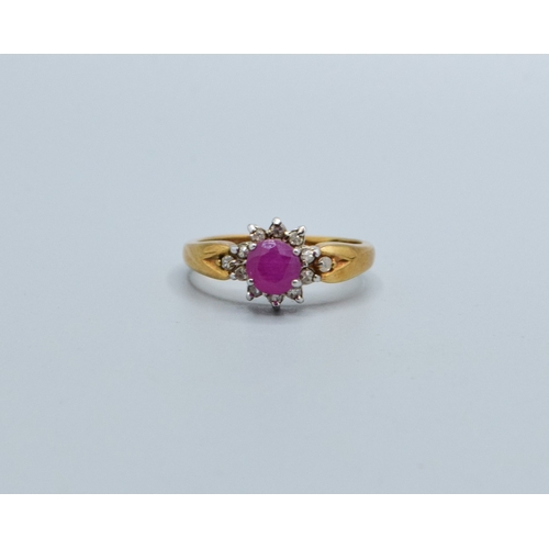 245 - 9ct gold ladies Ruby and Diamond cluster dress ring with a good size centre Ruby size N, 3.2grams