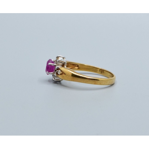 245 - 9ct gold ladies Ruby and Diamond cluster dress ring with a good size centre Ruby size N, 3.2grams