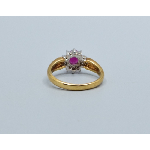 245 - 9ct gold ladies Ruby and Diamond cluster dress ring with a good size centre Ruby size N, 3.2grams