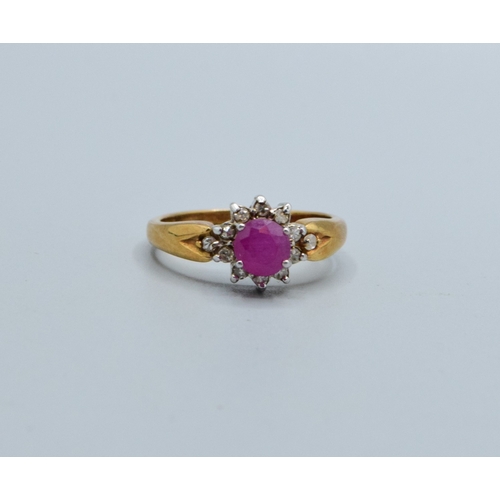 245 - 9ct gold ladies Ruby and Diamond cluster dress ring with a good size centre Ruby size N, 3.2grams