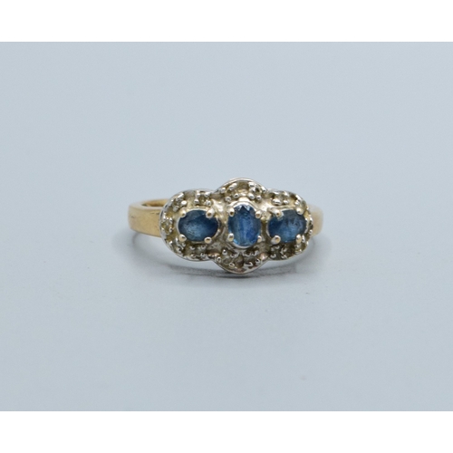 256 - 9ct gold ladies triple Tanzanite and Diamond graduated halo design ring size N, 3.5grams