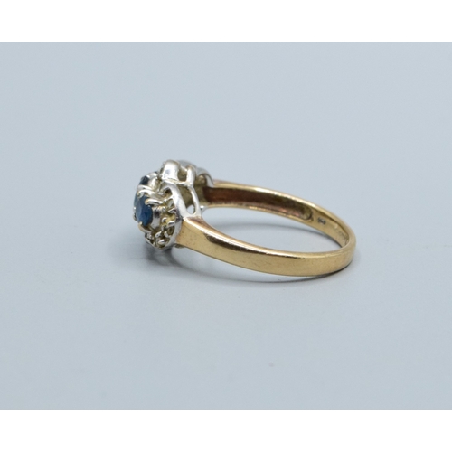 256 - 9ct gold ladies triple Tanzanite and Diamond graduated halo design ring size N, 3.5grams