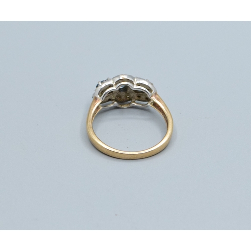 256 - 9ct gold ladies triple Tanzanite and Diamond graduated halo design ring size N, 3.5grams