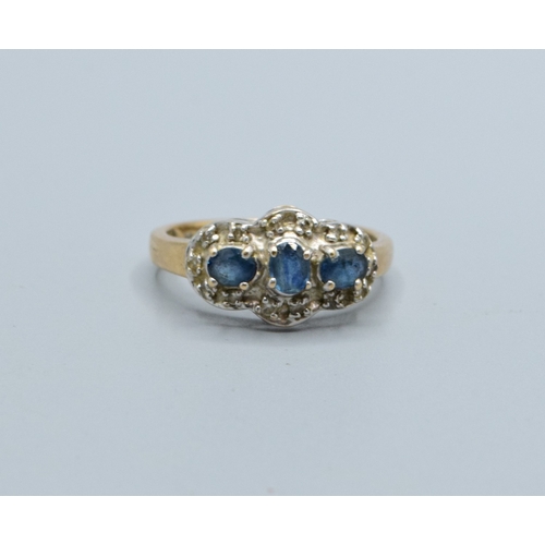 256 - 9ct gold ladies triple Tanzanite and Diamond graduated halo design ring size N, 3.5grams