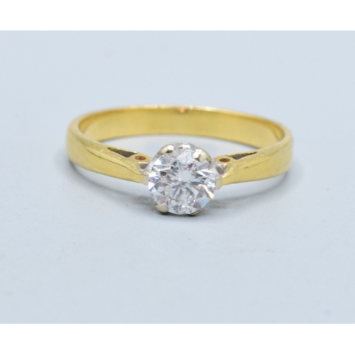 304 - 18ct gold ladies Diamond solitaire ring in a classic design the stone measures 5.5mm across the face... 