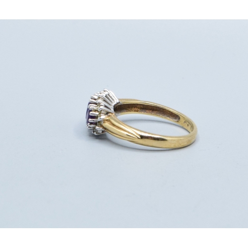 320 - 9ct gold ladies vintage 3 graduating stone halo Amethyst ring size L