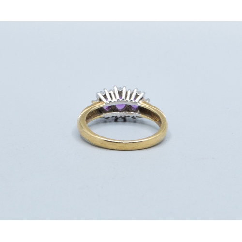 320 - 9ct gold ladies vintage 3 graduating stone halo Amethyst ring size L