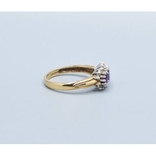 320 - 9ct gold ladies vintage 3 graduating stone halo Amethyst ring size L