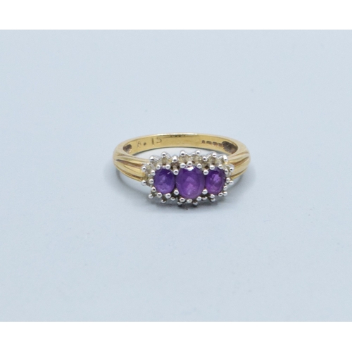 320 - 9ct gold ladies vintage 3 graduating stone halo Amethyst ring size L