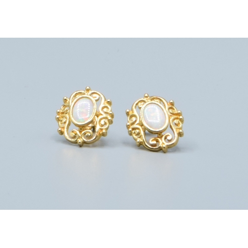 2 - 9ct gold Opal stud earrings with scroll work setting head size 14x9mm