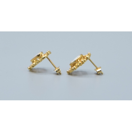 2 - 9ct gold Opal stud earrings with scroll work setting head size 14x9mm
