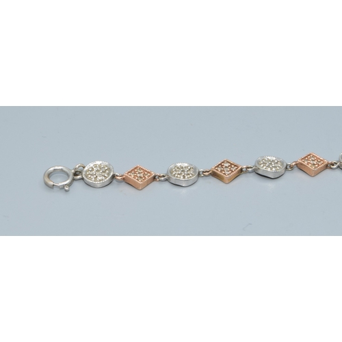 92 - 9ct twin colour gold bracelet with both square and round decoration set with accent Diamonds on each... 