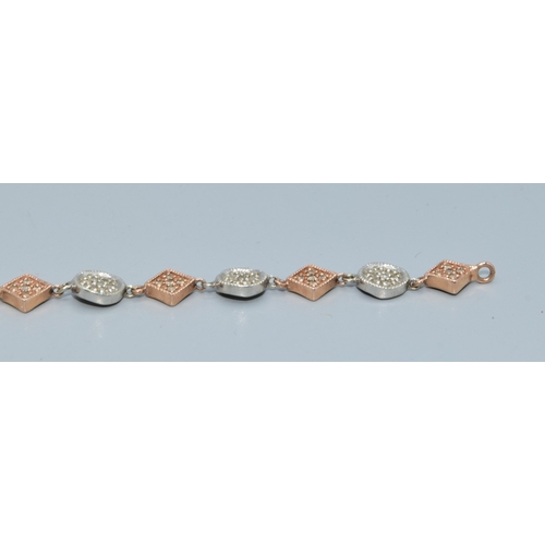 92 - 9ct twin colour gold bracelet with both square and round decoration set with accent Diamonds on each... 