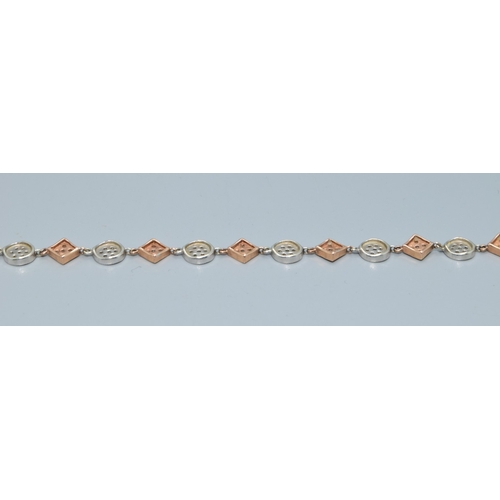 92 - 9ct twin colour gold bracelet with both square and round decoration set with accent Diamonds on each... 