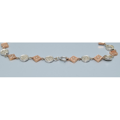 92 - 9ct twin colour gold bracelet with both square and round decoration set with accent Diamonds on each... 