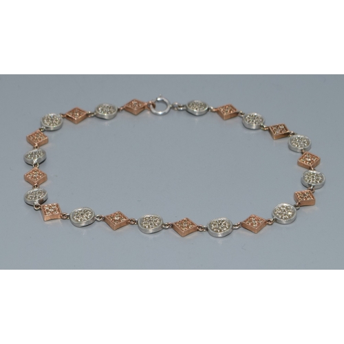 92 - 9ct twin colour gold bracelet with both square and round decoration set with accent Diamonds on each... 