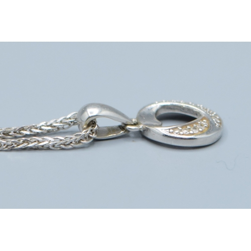 107 - 9ct white gold Diamond pendant necklace on a 9ct white gold chain of 44cm long pendant being 10mm di... 