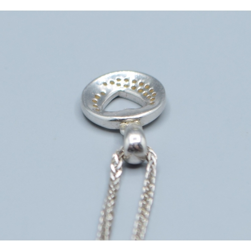 107 - 9ct white gold Diamond pendant necklace on a 9ct white gold chain of 44cm long pendant being 10mm di... 