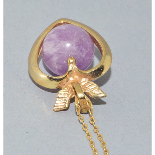 109 - 9ct gold pendant necklace.  Cherub top on a Heart centrally set with an Amethyst sphere.  On a 9ct g... 