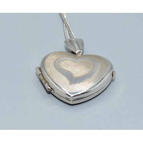 169 - 9ct white gold heart picture locket on a 9ct white gold chain of 44cm long with a plain cartouche a ... 