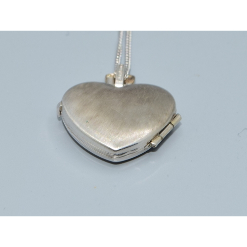 169 - 9ct white gold heart picture locket on a 9ct white gold chain of 44cm long with a plain cartouche a ... 