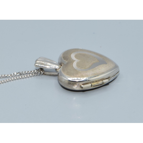 169 - 9ct white gold heart picture locket on a 9ct white gold chain of 44cm long with a plain cartouche a ... 