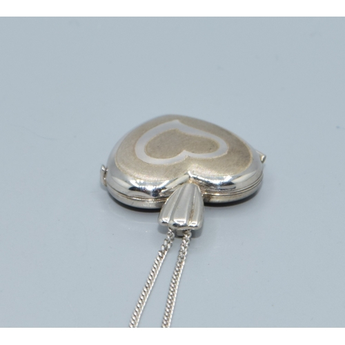 169 - 9ct white gold heart picture locket on a 9ct white gold chain of 44cm long with a plain cartouche a ... 