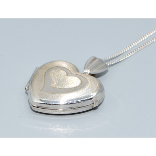 169 - 9ct white gold heart picture locket on a 9ct white gold chain of 44cm long with a plain cartouche a ... 