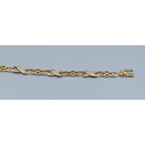 184 - 9ct gold fancy celtic cross over link Diamond decorated ladies bracelet 19cm long 5.5mm wide 6.5gram... 