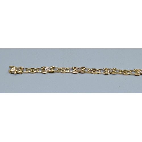 184 - 9ct gold fancy celtic cross over link Diamond decorated ladies bracelet 19cm long 5.5mm wide 6.5gram... 