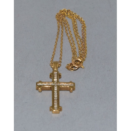 259 - 9ct gold Diamond set crucifix pendant necklace the Diamonds in a fix channel setting estimated as 0.... 