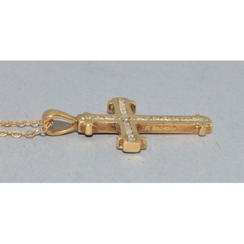 259 - 9ct gold Diamond set crucifix pendant necklace the Diamonds in a fix channel setting estimated as 0.... 