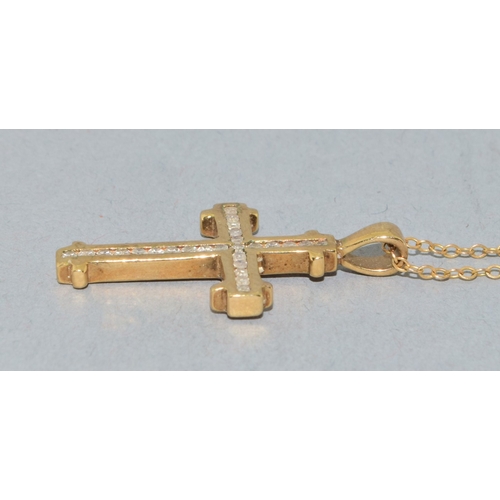 259 - 9ct gold Diamond set crucifix pendant necklace the Diamonds in a fix channel setting estimated as 0.... 