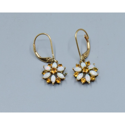 274 - 9ct gold ladies vintage Opal and Citrine star shape clip on earrings held in a claw design the earri... 