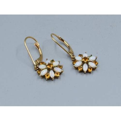 274 - 9ct gold ladies vintage Opal and Citrine star shape clip on earrings held in a claw design the earri... 