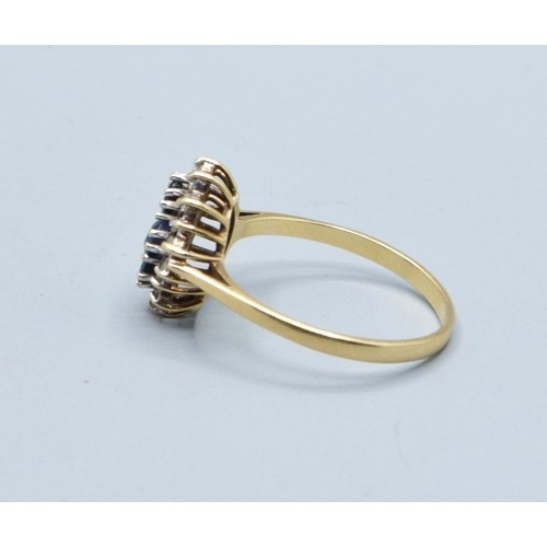 10 - 9ct gold vintage ladies sapphire and Diamond halo dress ring in a claw design size S, 2.6grams