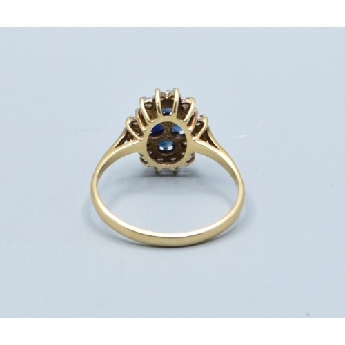 10 - 9ct gold vintage ladies sapphire and Diamond halo dress ring in a claw design size S, 2.6grams