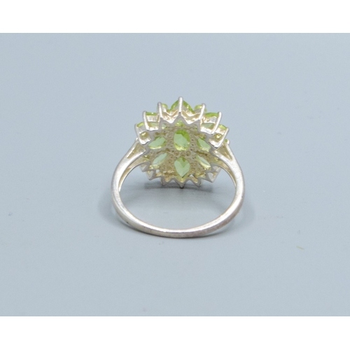 173 - 925 silver ladies enhanced Peridot star burst statement ring the head being18mm diameter size O
