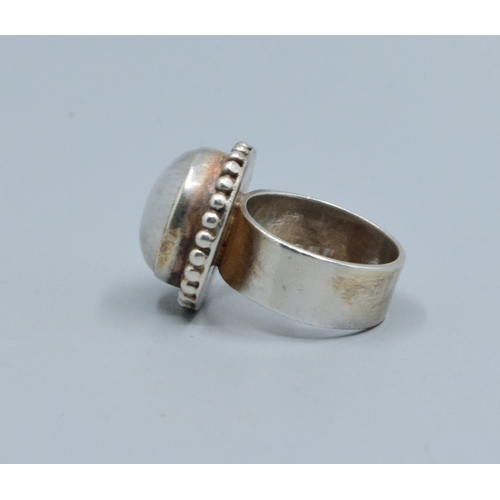 186 - 925 silver ladies Rainbow Moonstone solitaire dress ring held in an enclosed design size M