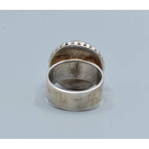 186 - 925 silver ladies Rainbow Moonstone solitaire dress ring held in an enclosed design size M