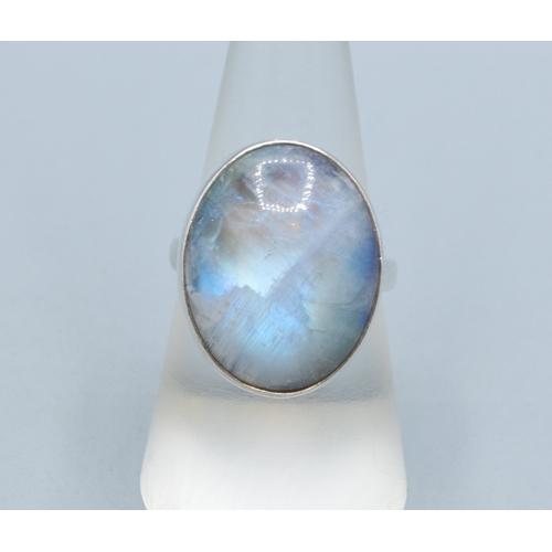 216 - Rainbow Moonstone 925 silver ladies ring in an oval shape with the head measuring 23x18mm held in an... 