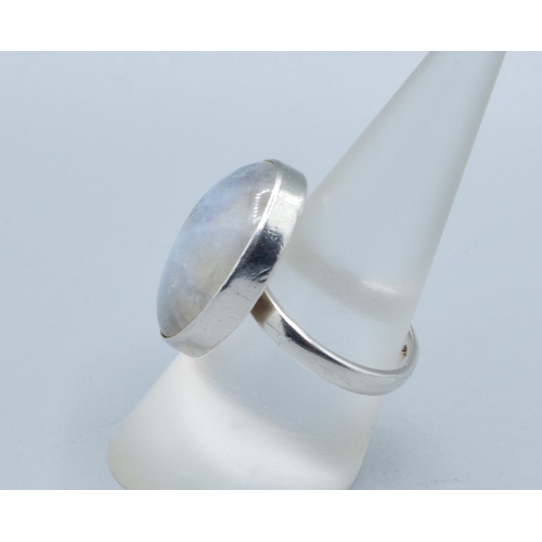 216 - Rainbow Moonstone 925 silver ladies ring in an oval shape with the head measuring 23x18mm held in an... 
