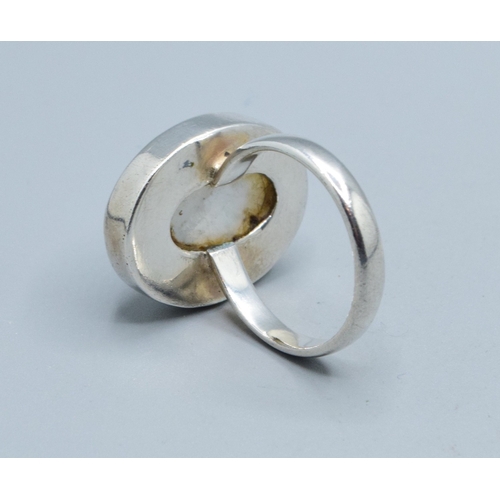 216 - Rainbow Moonstone 925 silver ladies ring in an oval shape with the head measuring 23x18mm held in an... 