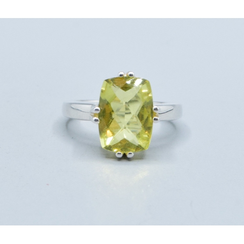 27 - 925 silver ladies facetted single stone lemon Quarts dress ring held in a claw design 16x12mm stone,... 