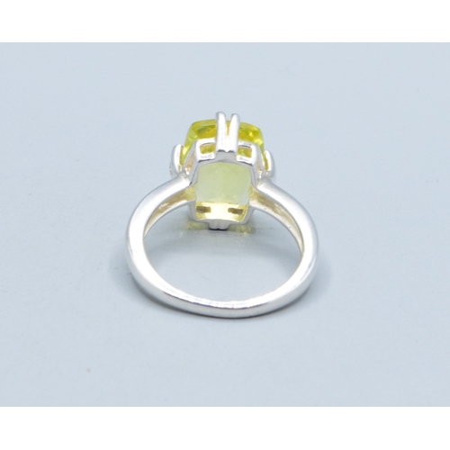 27 - 925 silver ladies facetted single stone lemon Quarts dress ring held in a claw design 16x12mm stone,... 