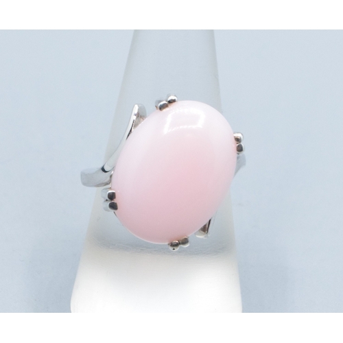 29 - 925 silver ladies contemporary design cabochon unpolished Pink Opal solitaire ring in a claw twist d... 