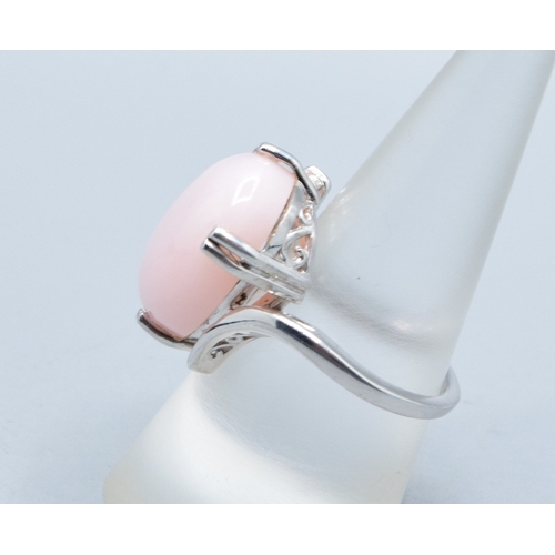 29 - 925 silver ladies contemporary design cabochon unpolished Pink Opal solitaire ring in a claw twist d... 