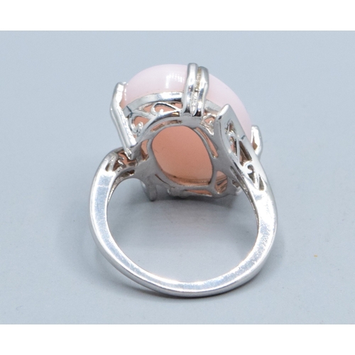 29 - 925 silver ladies contemporary design cabochon unpolished Pink Opal solitaire ring in a claw twist d... 