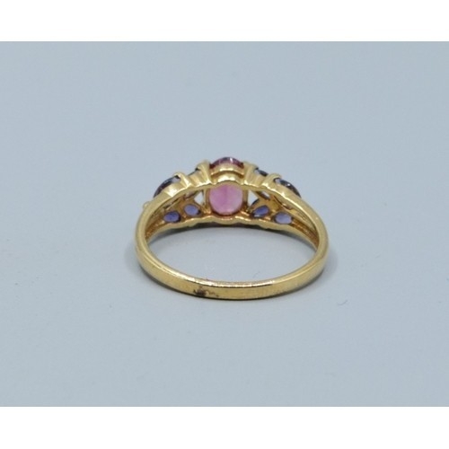 278 - 9ct gold ladies dress ring set with central Amethyst size N