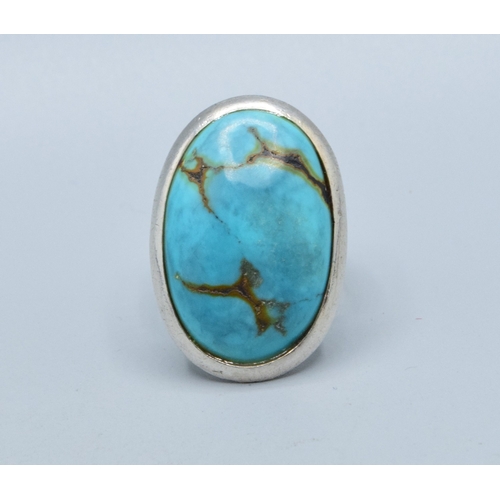 291 - 925 silver ladies large oval Turquoise adjustable statement ring the head measures 32x22mm size Q